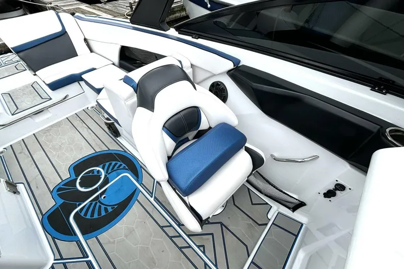 Slide: The Image of 2020 Scarab 255 ID Wake boat interior with blue and white seating and stylish flooring design. - 19
