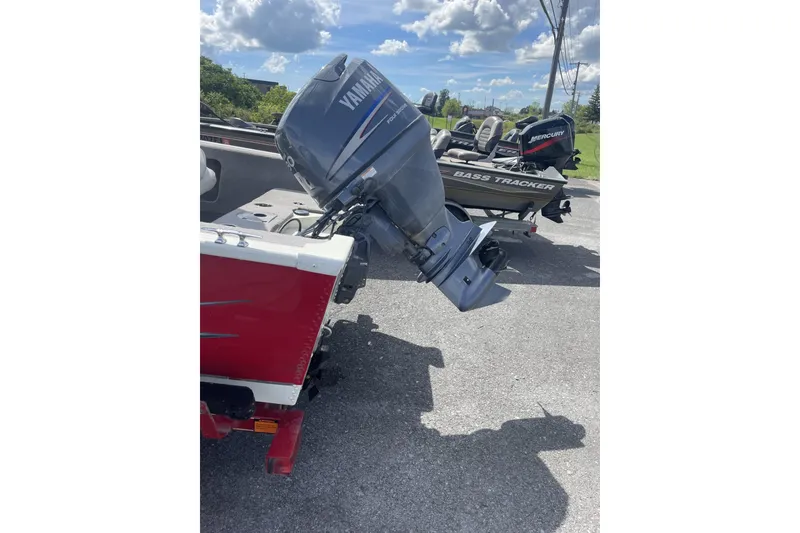 Slide: The Image of 2008 Starcraft 170 DC boat with Yamaha outboard motor, parked outdoors. - 2