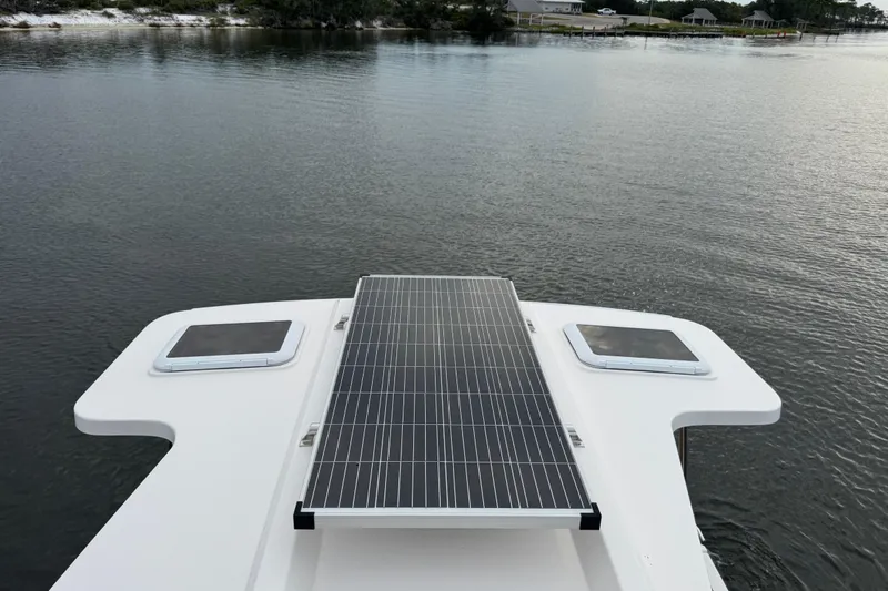 Slide: The Image of Solar panel on 2022 Ranger Tugs R-31 CB boat, docked on calm water. - 23
