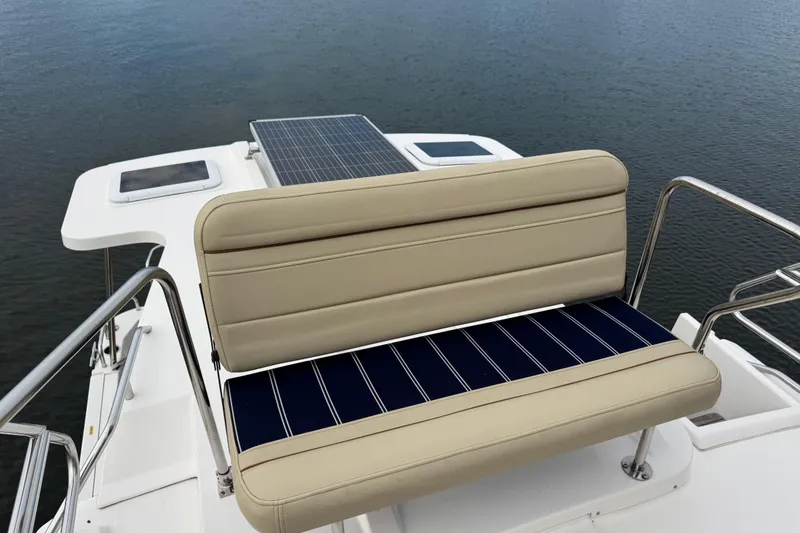 Slide: The Image of 2022 Ranger Tugs R-31 CB boat with cushioned seating and solar panel on deck. - 27