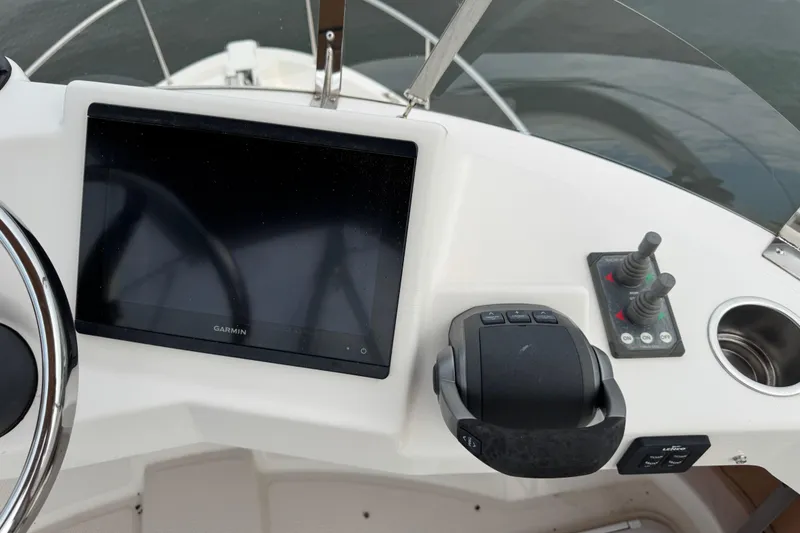 Slide: The Image of Control panel of 2022 Ranger Tugs R-31 CB with Garmin display and joystick controls. - 30