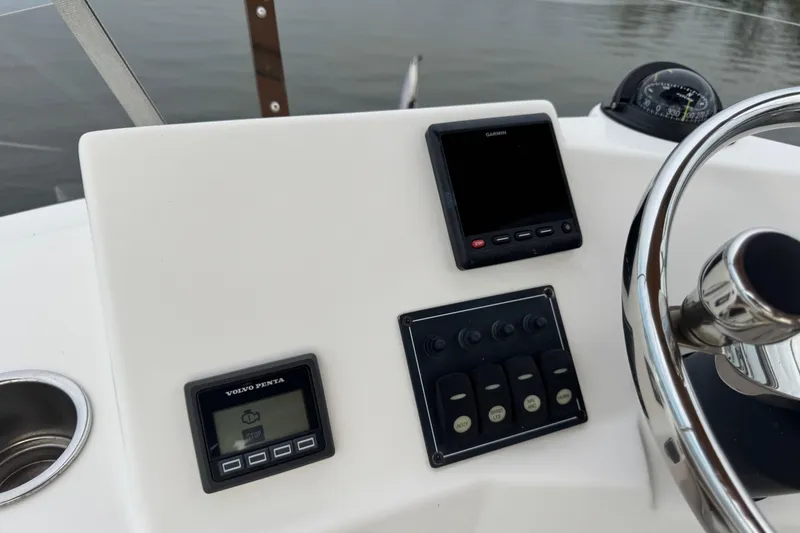 Slide: The Image of 2022 Ranger Tugs R-31 CB helm with Garmin display and Volvo Penta controls. - 31