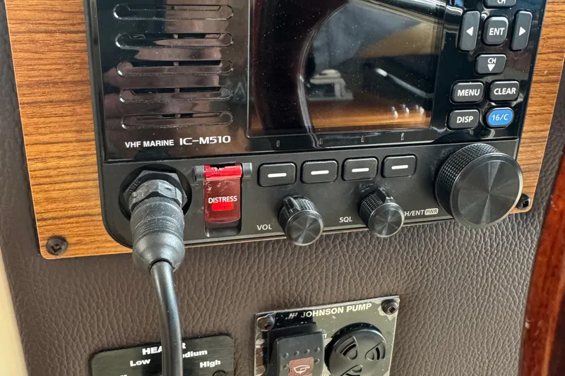 Slide: The Image of VHF marine radio controls on 2022 Ranger Tugs R-31 CB boat dashboard. - 44