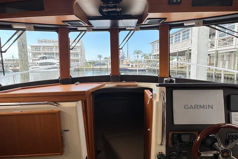 Slide: The Image of Interior view of 2022 Ranger Tugs R-31 CB boat with Garmin navigation system. - 49