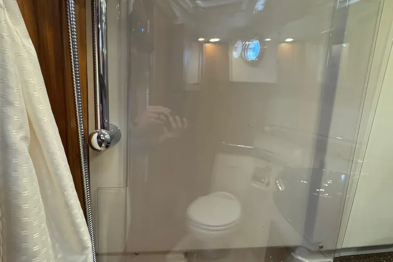 Slide: The Image of Interior bathroom of 2022 Ranger Tugs R-31 CB with shower and toilet. - 75