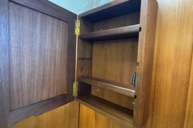 Slide: The Image of Wooden cabinet interior on 2022 Ranger Tugs R-31 CB boat. - 77