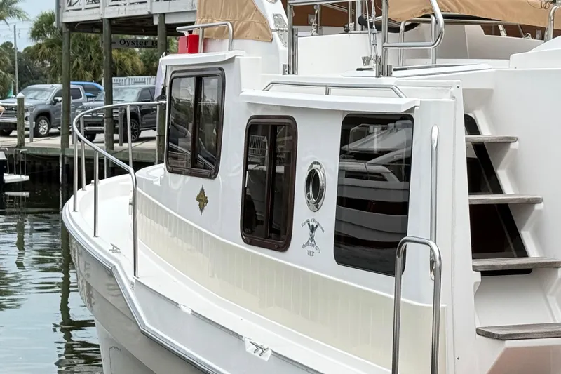 Slide: The Image of 2022 Ranger Tugs R-31 CB boat docked, featuring sleek design and modern amenities. - 8