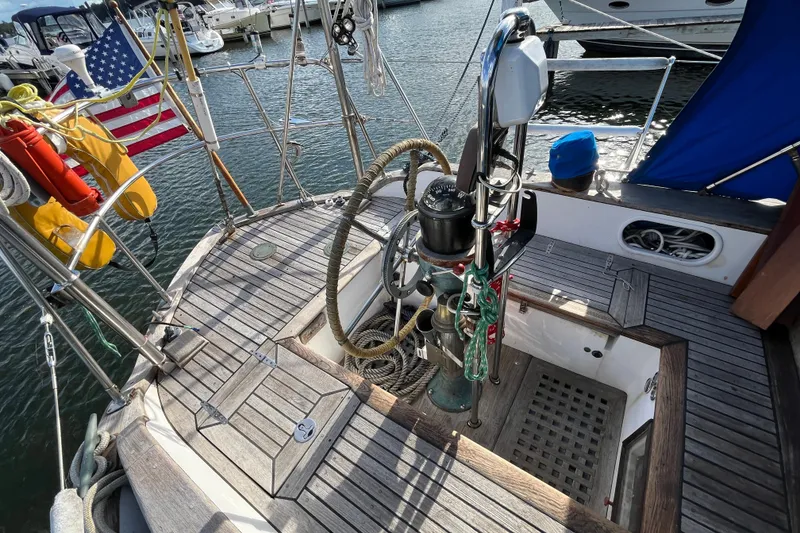 Slide: The Image of Cockpit of 1982 Tayana 37 sailboat with wooden deck and nautical equipment. - 17