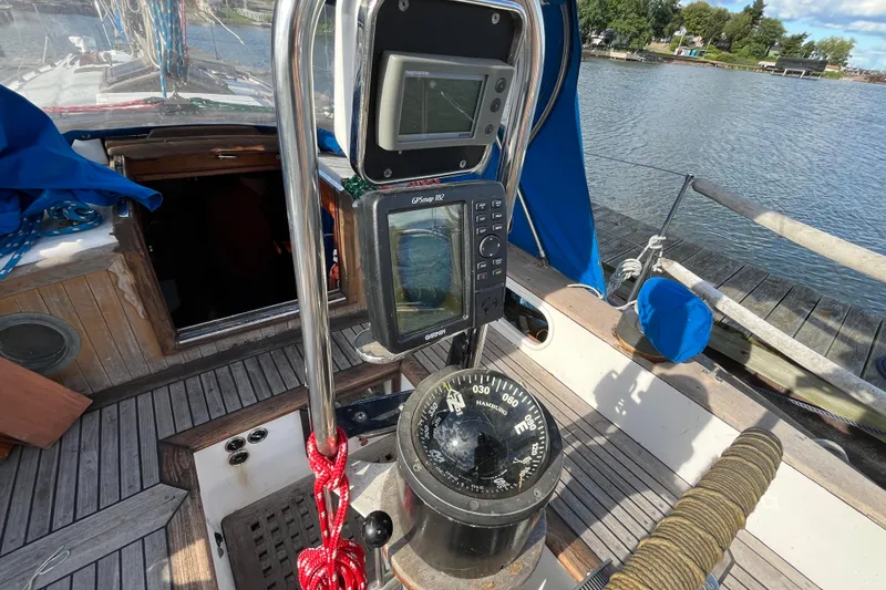 Slide: The Image of Cockpit of 1982 Tayana 37 sailboat with navigation instruments and compass. - 21