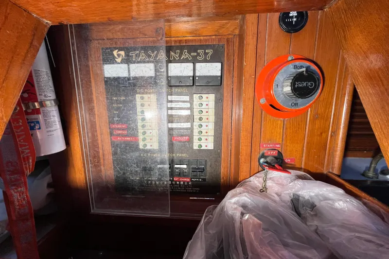 Slide: The Image of Electrical panel of 1982 Tayana 37 sailboat with switches and gauges. - 26