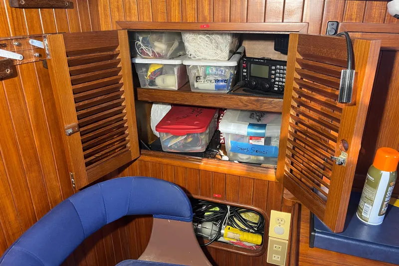 Slide: The Image of Wooden cabinet interior on 1982 Tayana 37 sailboat, storing equipment and supplies. - 41