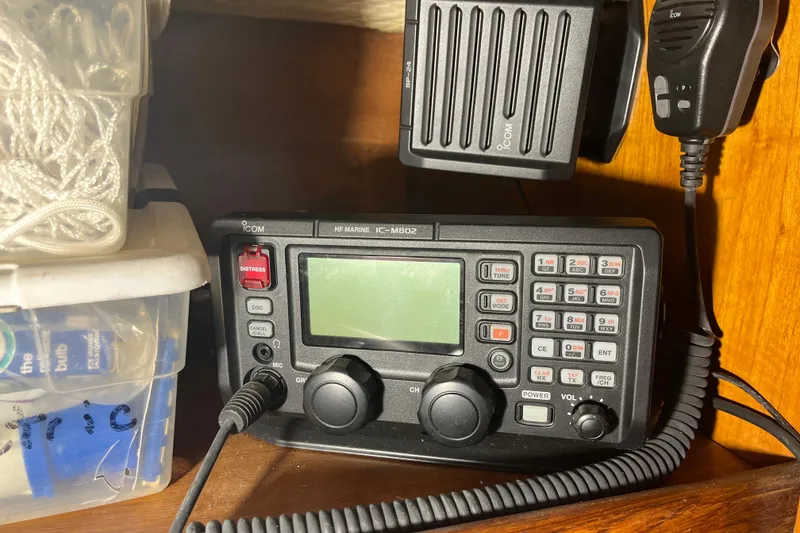 Slide: The Image of Marine radio equipment on 1982 Tayana 37 sailboat, featuring Icom IC-M802 model. - 42