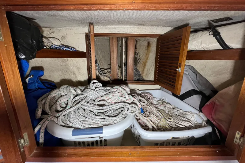 Slide: The Image of Storage area on 1982 Tayana 37 sailboat with ropes and equipment. - 77