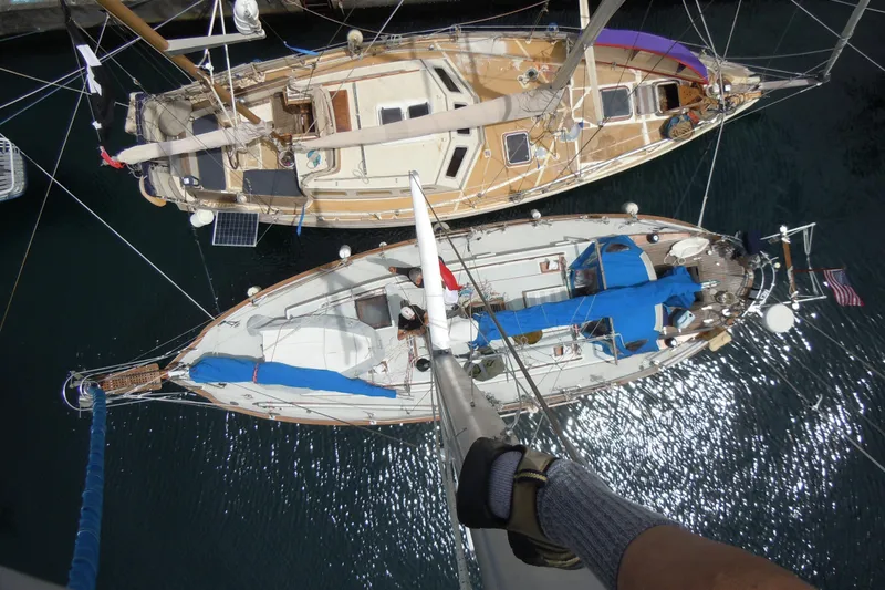 Slide: The Image of Aerial view of two sailboats, including a 1982 Tayana 37, docked side by side. - 79