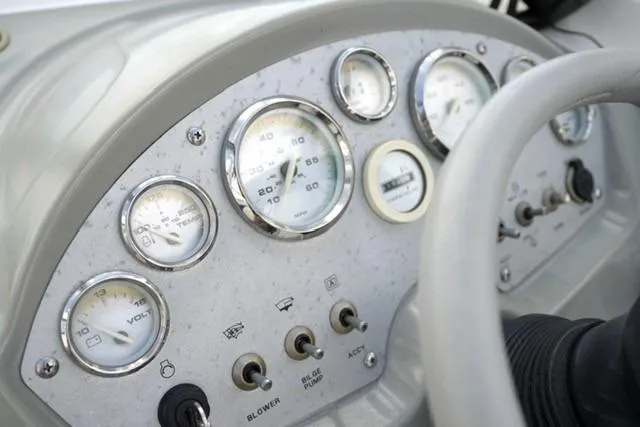 Slide: The Image of Dashboard of 2006 Bayliner 195 Classic boat with gauges and controls. - 11