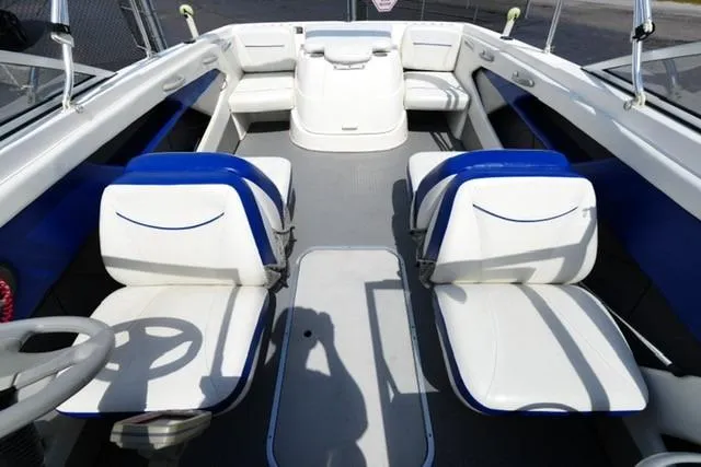 Slide: The Image of 2006 Bayliner 195 Classic boat interior with white and blue seating. - 13