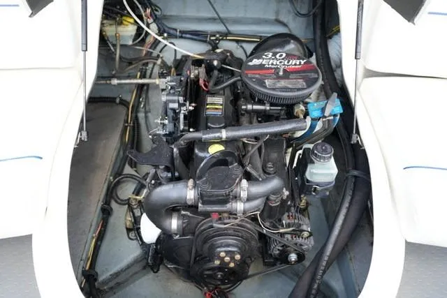 Slide: The Image of 2006 Bayliner 195 Classic boat engine compartment with 3.0L Mercury motor. - 15
