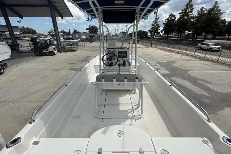 Slide: The Image of 2003 Skeeter ZX2400 boat interior with storage compartments and seating. - 8