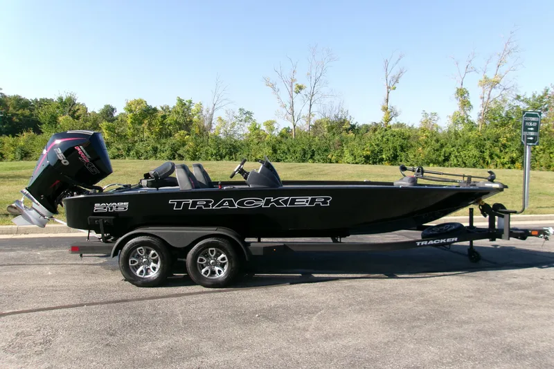 The Image of 2026 Tracker Savage 215 boat on trailer, parked outdoors, side view. - 0