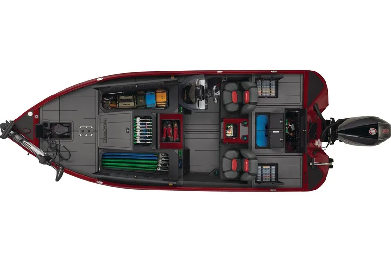 Slide: The Image of 2026 Tracker Savage 215 boat interior with steering wheel and seating, parked on pavement. - 5