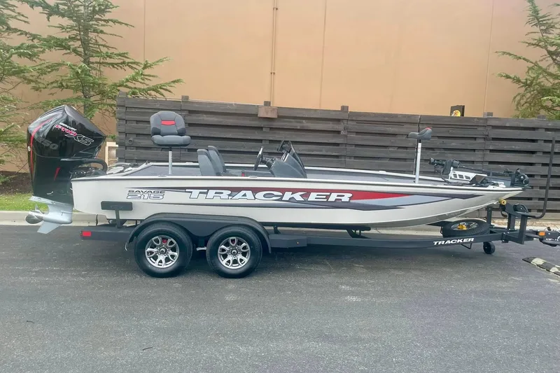 The Image of 2026 Tracker Savage 215 boat on trailer, parked outdoors, side view. - 0