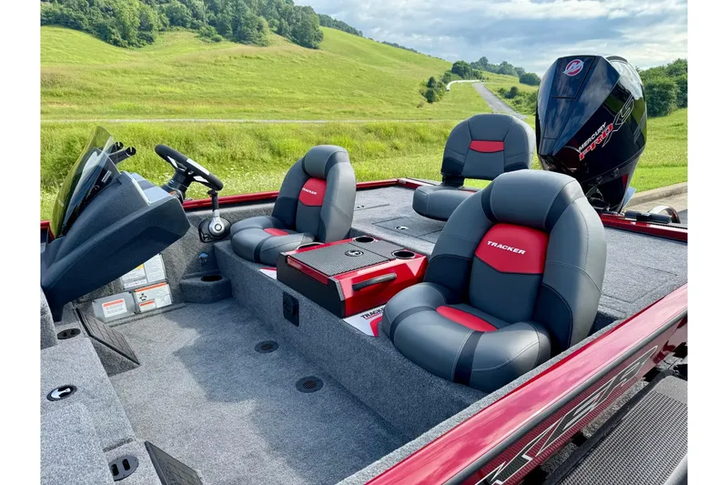 Slide: The Image of 2026 Tracker Savage 215 boat interior with plush seating and modern dashboard. - 5