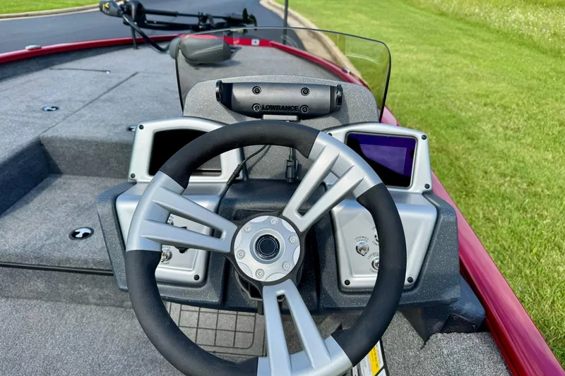 Slide: The Image of Steering console of 2026 Tracker Savage 215 boat with modern controls and displays. - 8