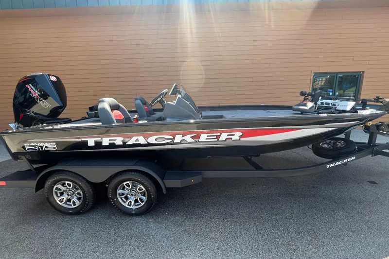 The Image of 2026 Tracker Savage 215 boat on trailer, sleek design, outdoor setting. - 0