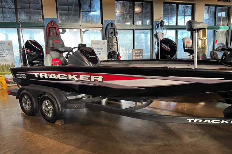 The Image of 2026 Tracker Savage 215 boat displayed indoors on a trailer. - 0