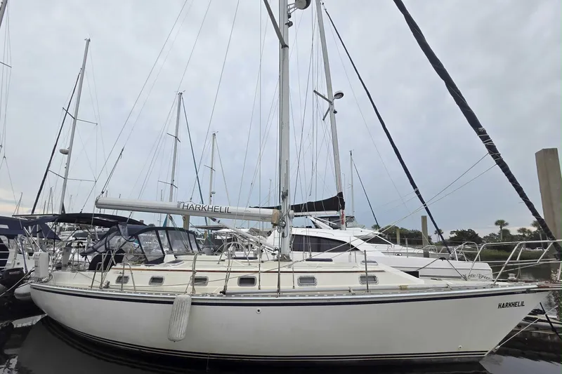 The Image of 2001 Caliber 40LRC sailboat docked at marina, featuring sleek design and multiple masts. - 0