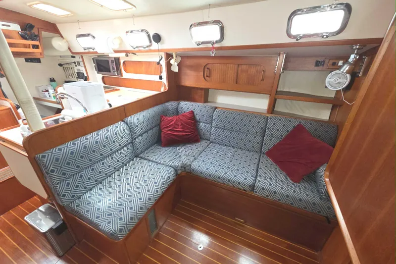 Slide: The Image of Cozy interior of 2001 Caliber 40LRC yacht with patterned seating and wooden accents. - 17