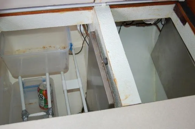 Slide: The Image of Open storage compartment in 2001 Caliber 40LRC boat with a beverage can inside. - 19