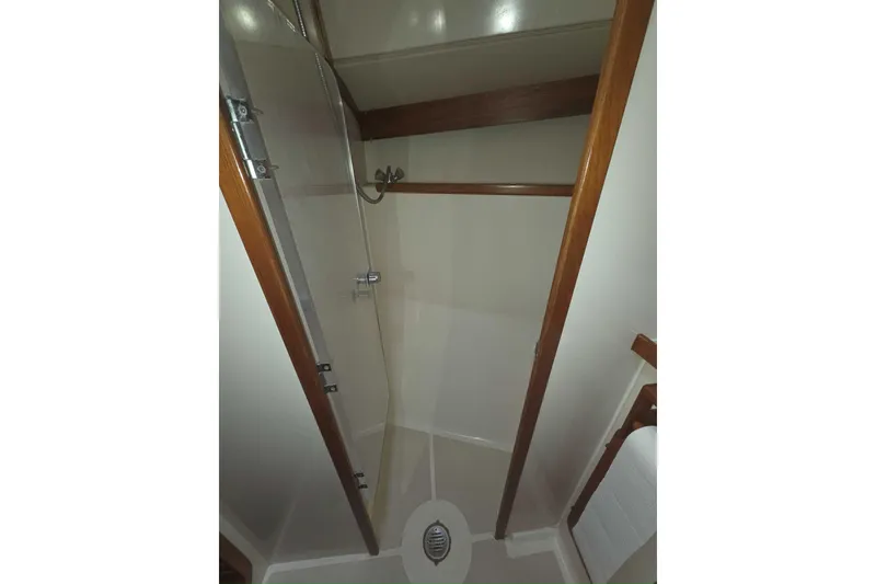 Slide: The Image of Shower area in 2001 Caliber 40LRC yacht with wooden accents and glass door. - 28