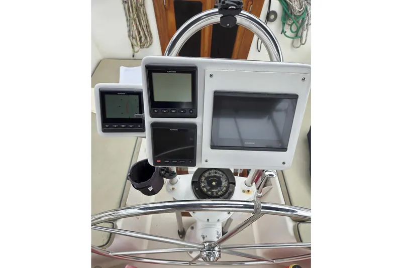 Slide: The Image of Caliber 40LRC 2001 yacht helm with Garmin navigation displays and compass. - 8