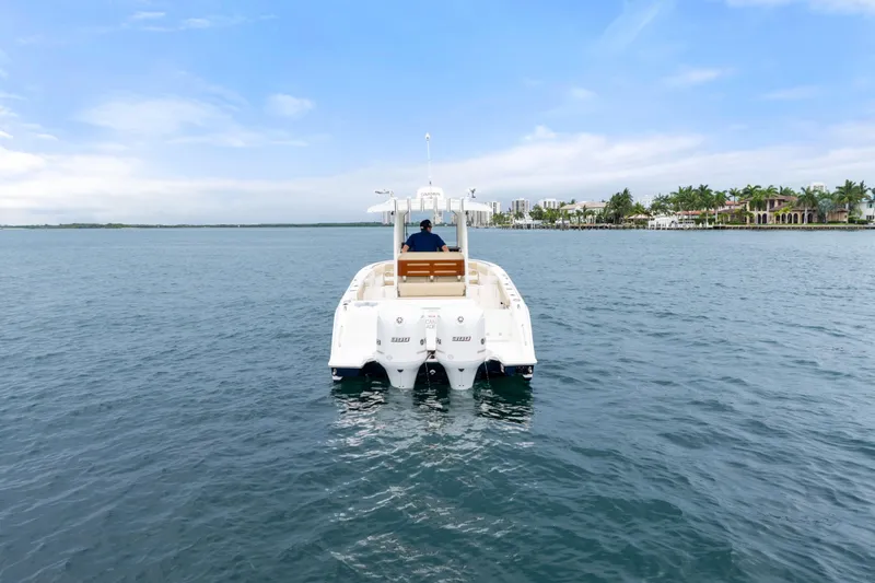 Slide: The Image of 2019 Pursuit S 288 Sport boat cruising on open water. - 10