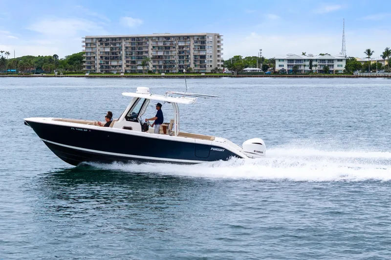 Slide: The Image of 2019 Pursuit S 288 Sport boat interior with beige seating and armrests. - 20