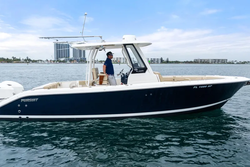 Slide: The Image of 2019 Pursuit S 288 Sport boat interior with seating and storage compartments. - 26