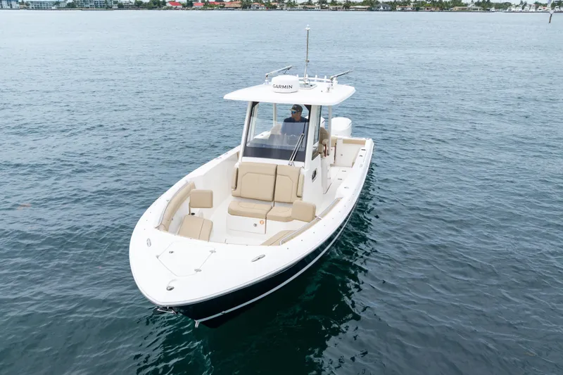 Slide: The Image of 2019 Pursuit S 288 Sport boat control panel with switches and dials. - 27