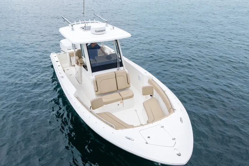 Slide: The Image of 2019 Pursuit S 288 Sport boat interior with water view and city skyline. - 35