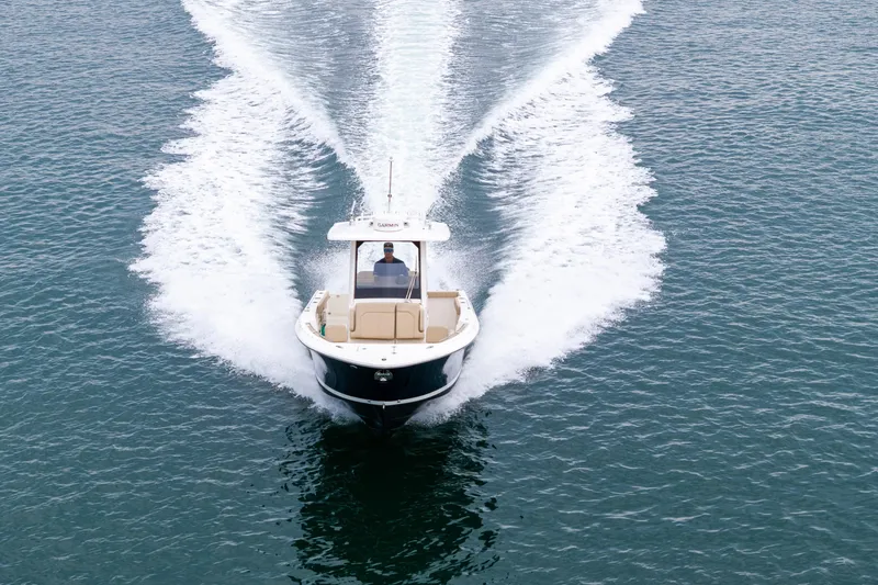 Slide: The Image of 2019 Pursuit S 288 Sport boat on open water, rear view with twin engines. - 6