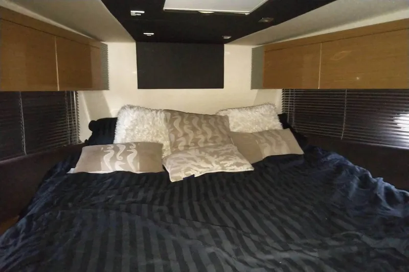 Slide: The Image of Luxurious bedroom interior of 2010 Azimut Atlantis 54 yacht with plush bedding. - 18