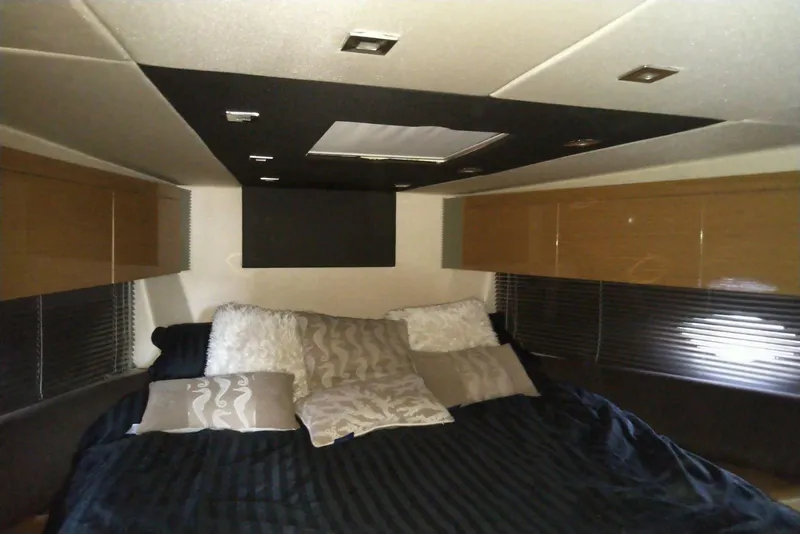 Slide: The Image of Luxurious bedroom interior of 2010 Azimut Atlantis 54 yacht with plush bedding and modern design. - 19