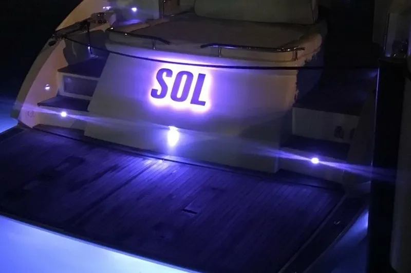Slide: The Image of Azimut Atlantis 54 yacht, 2010 model, illuminated at night with "SOL" signage. - 23