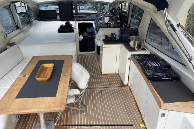Slide: The Image of Interior of 2010 Azimut Atlantis 54 yacht with modern amenities and wooden accents. - 25