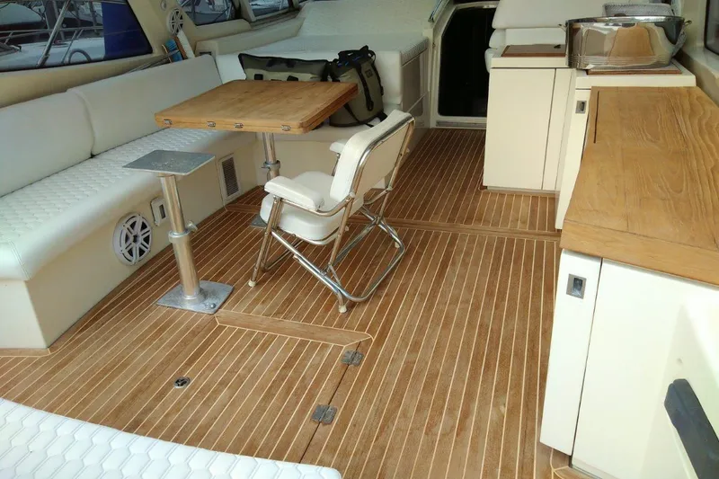 Slide: The Image of Interior of 2010 Azimut Atlantis 54 yacht with wooden flooring and seating area. - 9