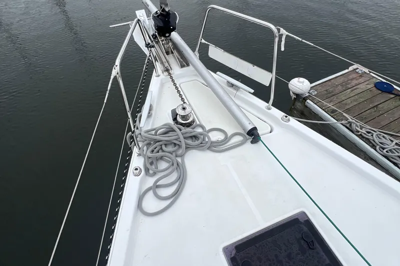 Slide: The Image of Beneteau Oceanis 41.1 sailboat deck with ropes and winch, docked at marina, 2020 model. - 10