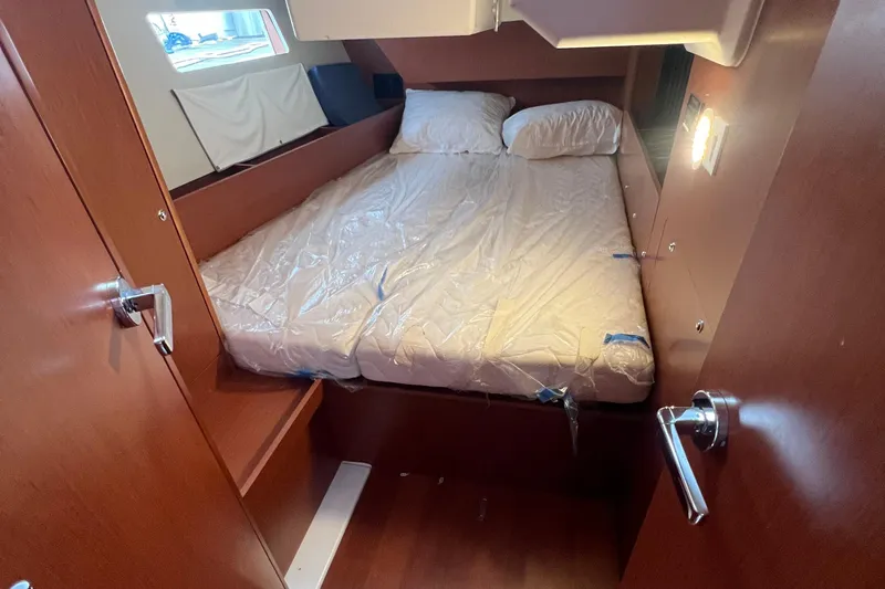 Slide: The Image of Cozy cabin interior of 2020 Beneteau Oceanis 41.1 yacht with double bed. - 3