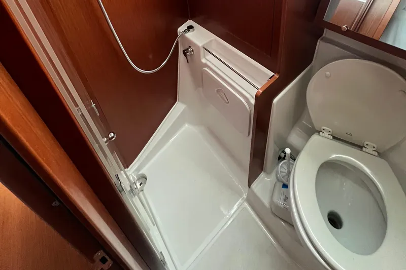 Slide: The Image of Bathroom interior of 2020 Beneteau Oceanis 41.1 yacht, featuring shower and toilet. - 5
