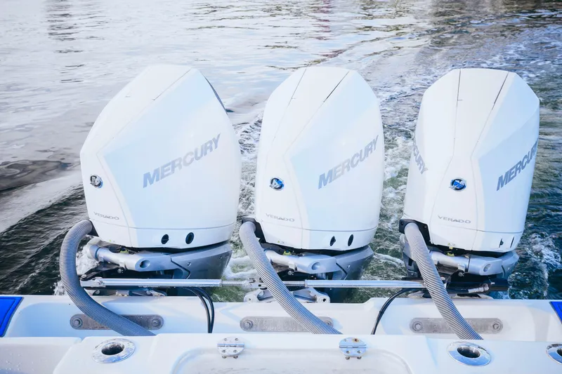 Slide: The Image of Triple Mercury Verado engines on a 2007 Yellowfin 36 Offshore boat. - 19