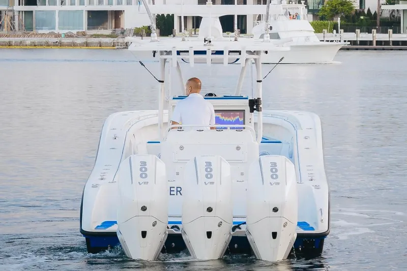 Slide: The Image of 2007 Yellowfin 36 Offshore boat with triple 300 V8 engines on water. - 3